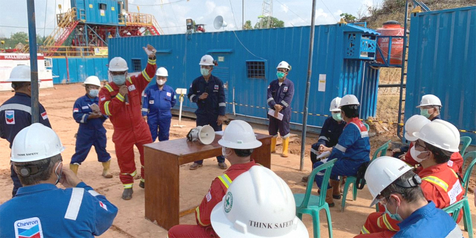 Group of people attending a site meeting.