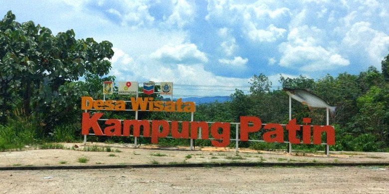 Kampung Patin Tourist Village signage on Riau-West Sumatera crossroad.